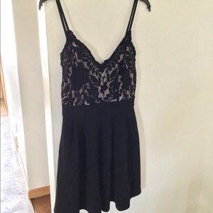 Nude and black fit and flare dress